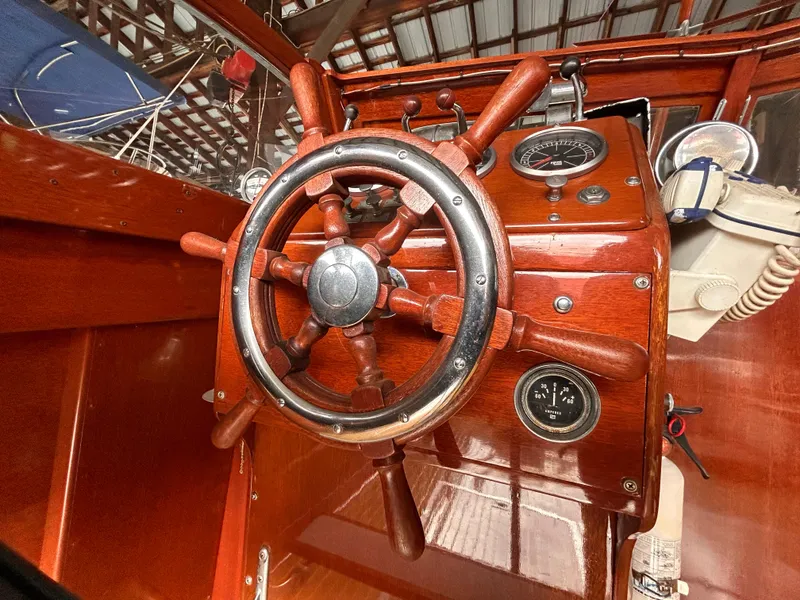 Slide: The Image of 1954 Chris-Craft Commander 336 Express Cruiser wooden helm and gauges. - 30