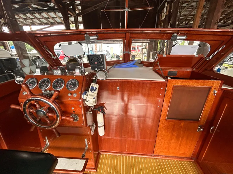 Slide: The Image of 1954 Chris-Craft Commander 336 Express Cruiser cockpit with vintage wooden dashboard and steering wheel. - 31
