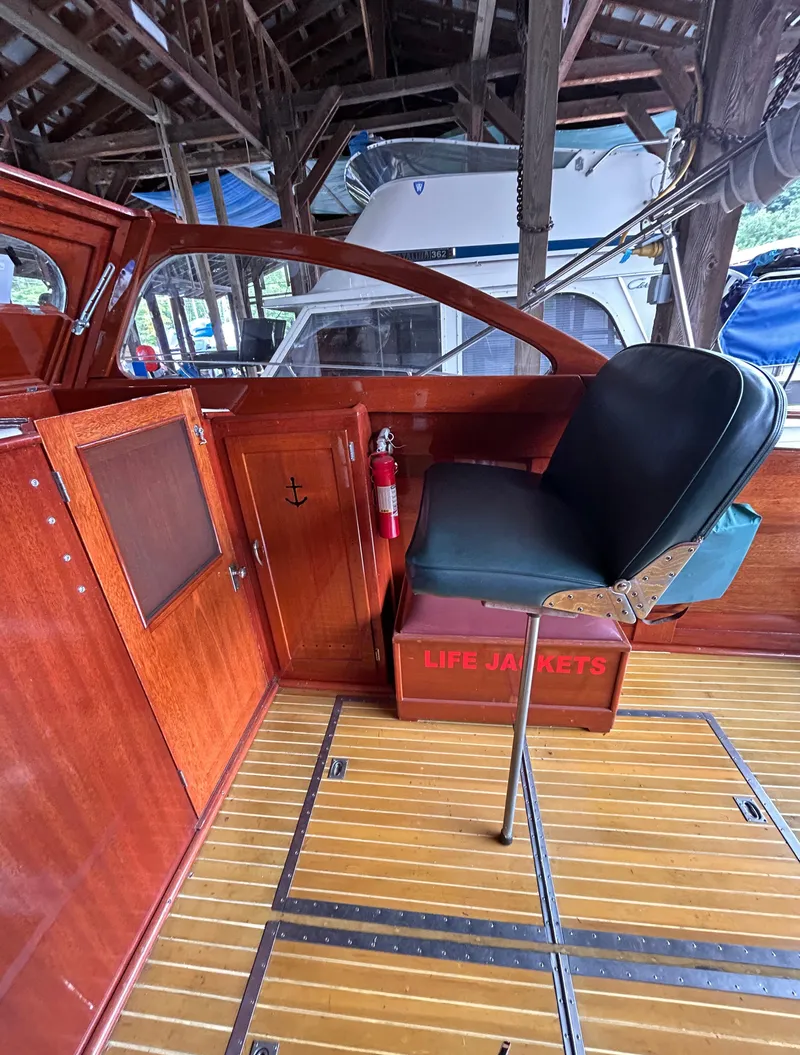 Slide: The Image of 1954 Chris-Craft Commander 336 Express Cruiser interior with wooden finish and seating. - 32