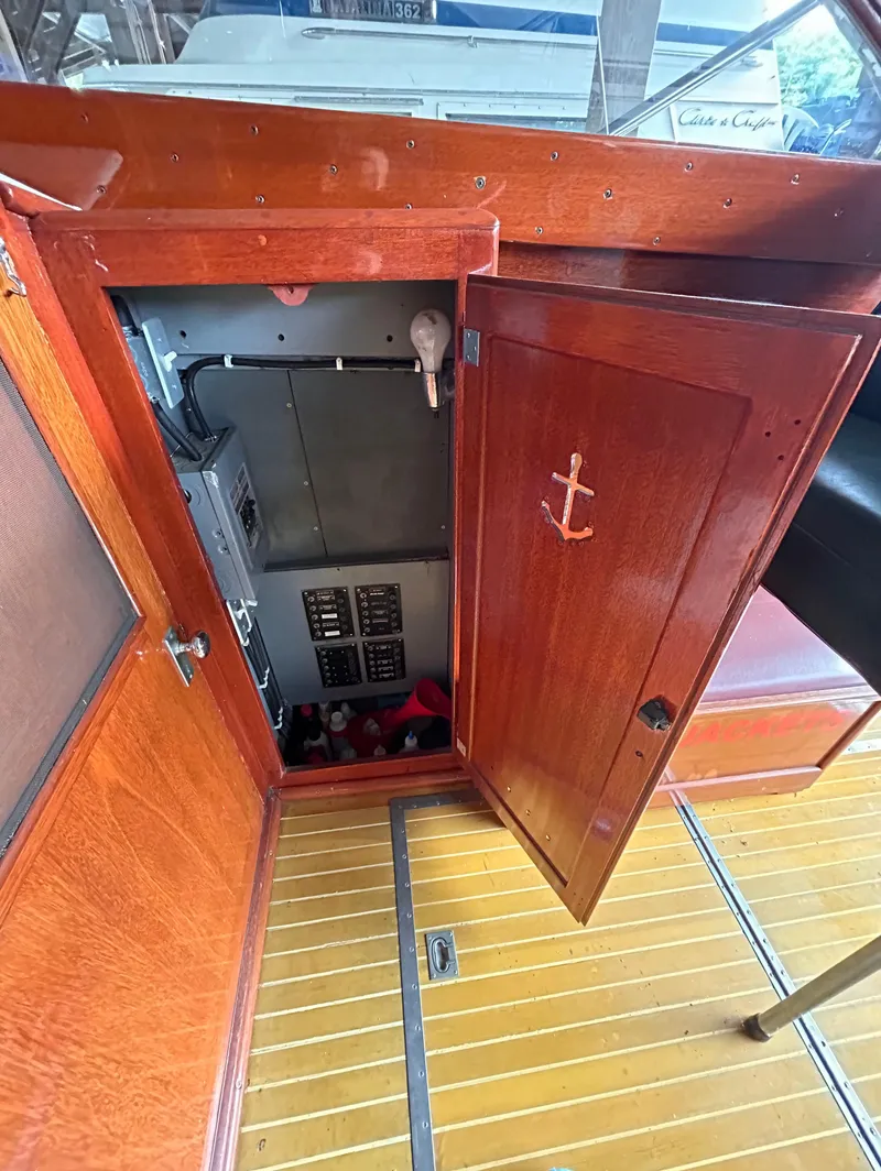 Slide: The Image of 1954 Chris-Craft Commander 336 Express Cruiser interior with wooden door and anchor detail. - 34