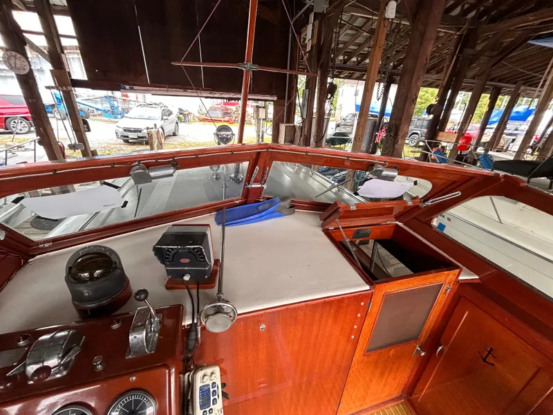 Slide: The Image of 1954 Chris-Craft Commander 336 Express Cruiser interior with classic wooden dashboard. - 37