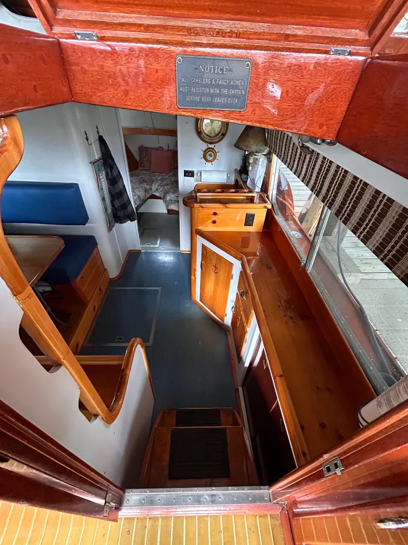 Slide: The Image of Interior of 1954 Chris-Craft Commander 336 Express Cruiser with wood finishes and nautical decor. - 38