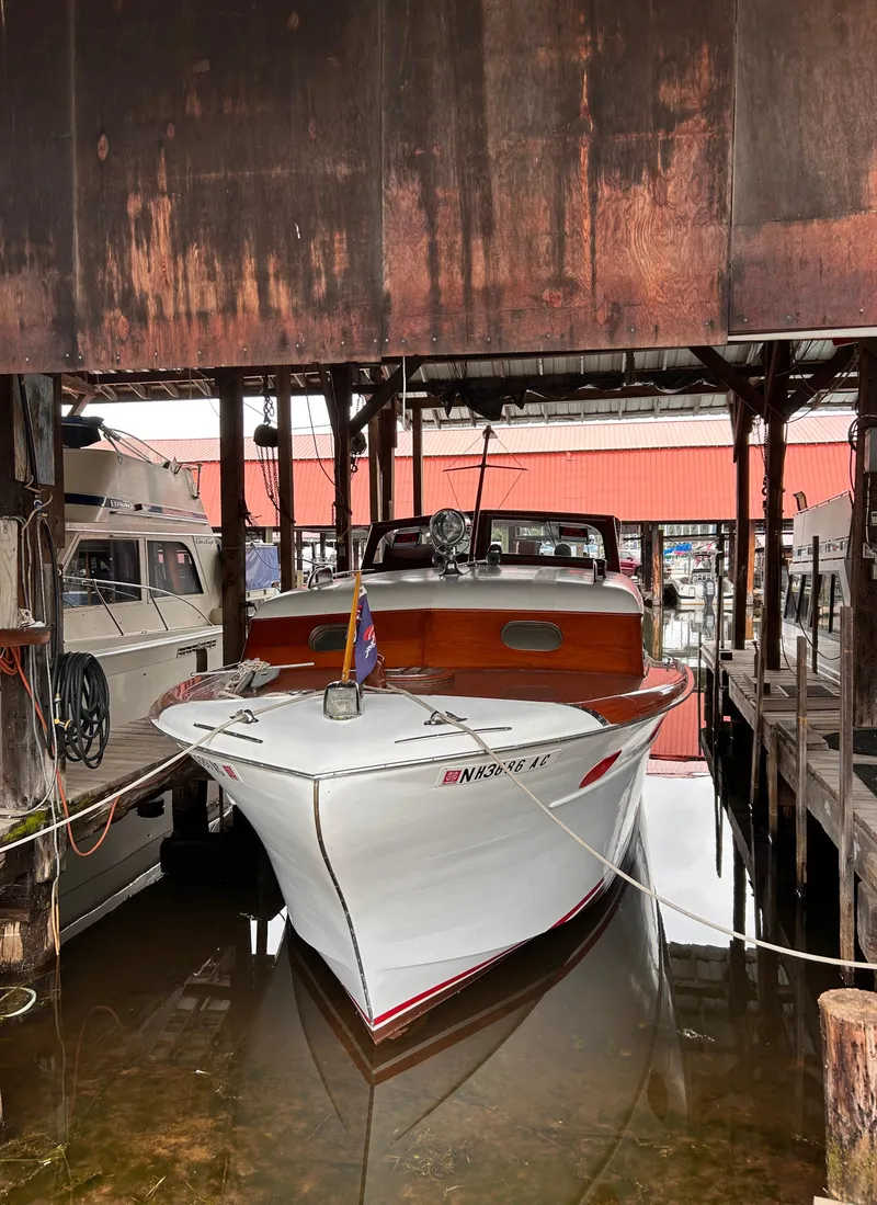 Slide: The Image of 1954 Chris-Craft Commander 336 Express Cruiser docked in a marina. - 4