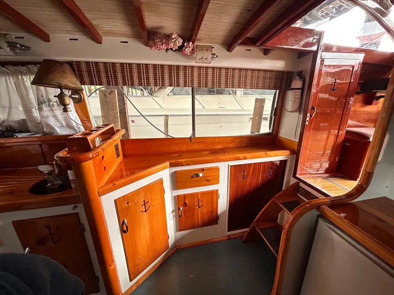 Slide: The Image of Vintage 1954 Chris-Craft Commander 336 Express Cruiser interior with wooden cabinetry. - 41