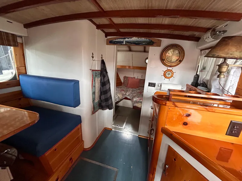 Slide: The Image of Interior of 1954 Chris-Craft Commander 336 Express Cruiser with wood accents and blue seating. - 45