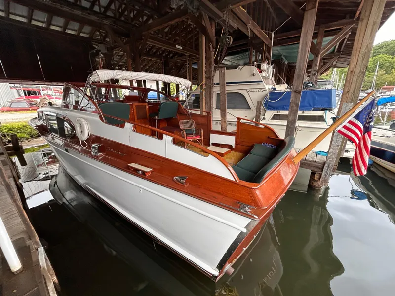 Slide: The Image of 1954 Chris-Craft Commander 336 Express Cruiser docked in a marina. - 7