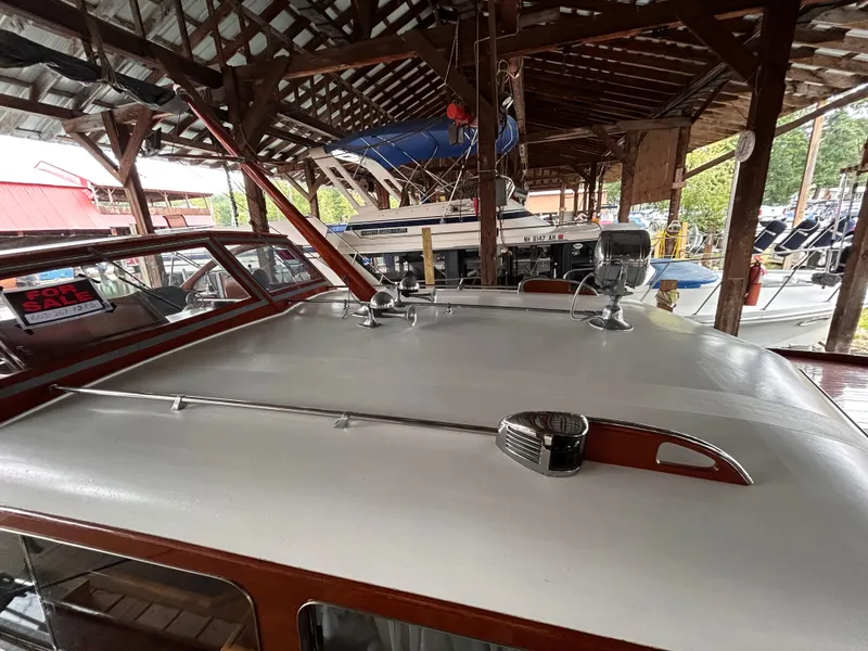 Slide: The Image of 1954 Chris-Craft Commander 336 Express Cruiser in a wooden boat shed. - 9