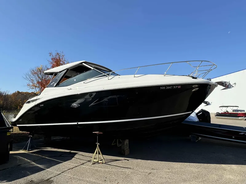 Slide: The Image of 2024 Sea Ray 320DA boat on display outdoors, clear sky background. - 1