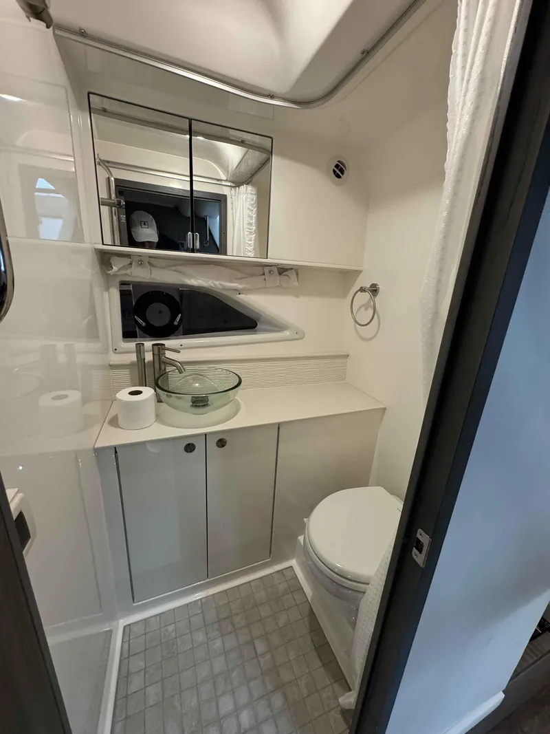 Slide: The Image of Modern bathroom in 2024 Sea Ray 320DA yacht with sleek fixtures and compact design. - 11