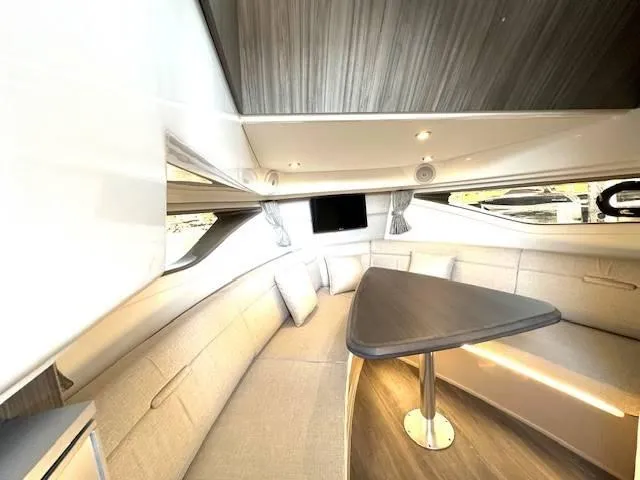 Slide: The Image of Luxurious interior of 2024 Sea Ray 320DA yacht with elegant seating and modern design. - 21