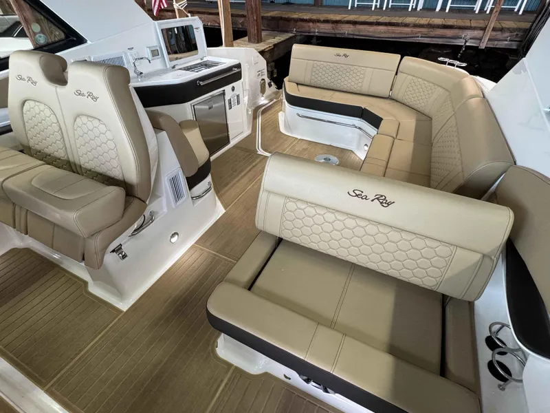 Slide: The Image of Luxurious interior of 2024 Sea Ray 320DA boat with beige seating and modern amenities. - 4
