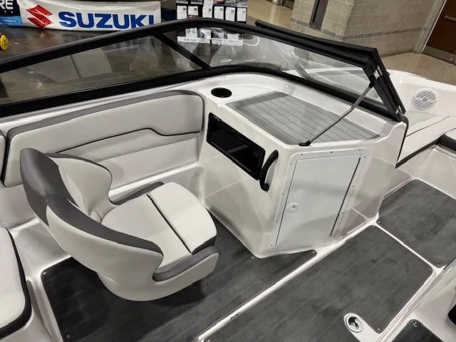Slide: The Image of 2025 Yamaha Boats SX190 interior with steering wheel, seating, and table. - 7