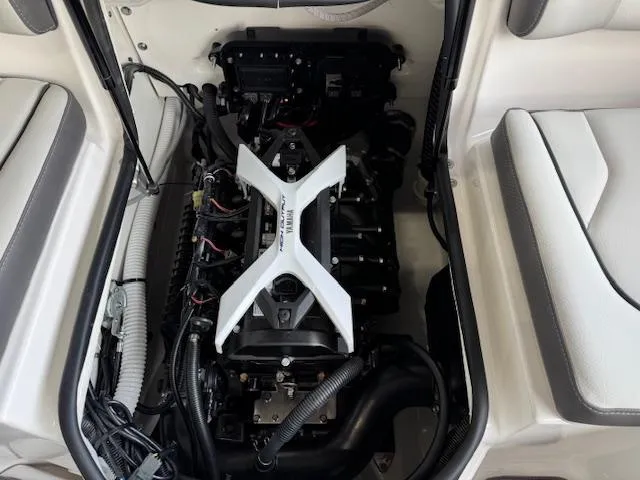 Slide: The Image of 2025 Yamaha Boats AR190 engine compartment with visible components and seating area. - 13