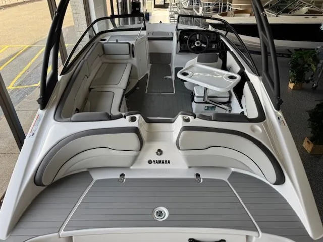 Slide: The Image of 2025 Yamaha AR190 boat interior with sleek seating and modern dashboard design. - 15
