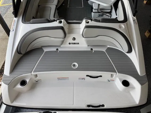 Slide: The Image of 2025 Yamaha Boats AR190, rear view, featuring sleek seating and modern design. - 16