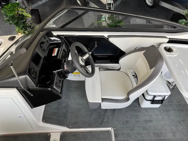 Slide: The Image of 2025 Yamaha Boats AR190 cockpit with steering wheel and comfortable seating. - 5