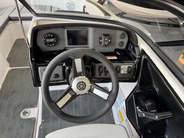 Slide: The Image of 2025 Yamaha Boats AR190 dashboard with steering wheel and control panel. - 6