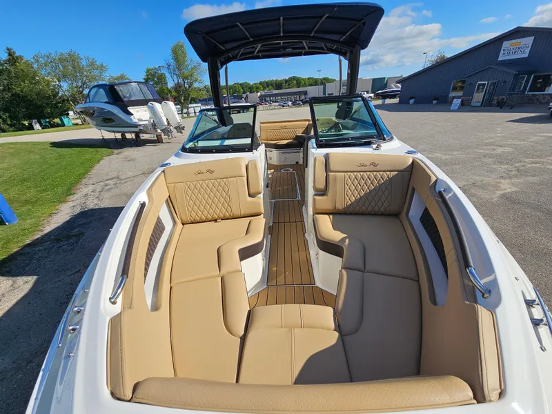 Slide: The Image of 2022 Sea Ray SLX 250 boat with tan interior and spacious seating. - 16