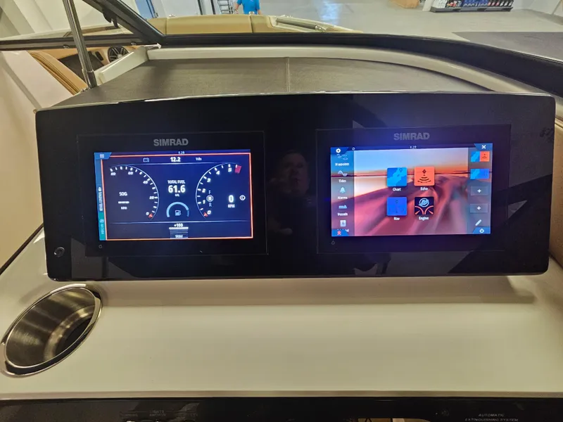 Slide: The Image of Simrad digital displays on 2022 Sea Ray SLX 250 boat dashboard. - 21