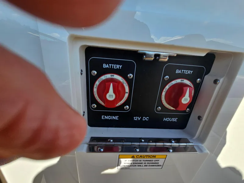 Slide: The Image of Battery switches on a 2022 Sea Ray SLX 250 boat, labeled for engine and house. - 25