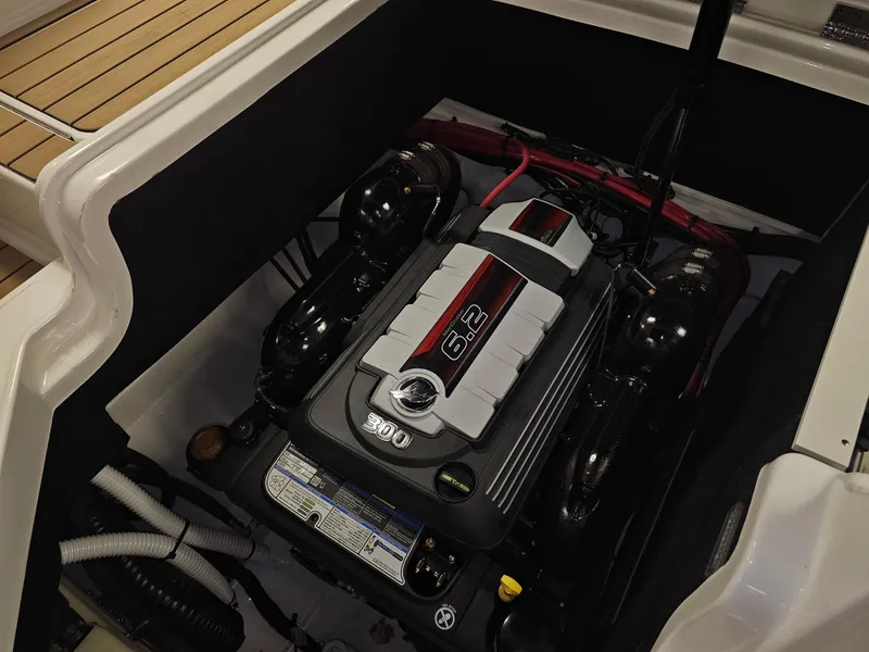 Slide: The Image of 2022 Sea Ray SLX 250 engine compartment with powerful 6.2L engine. - 27