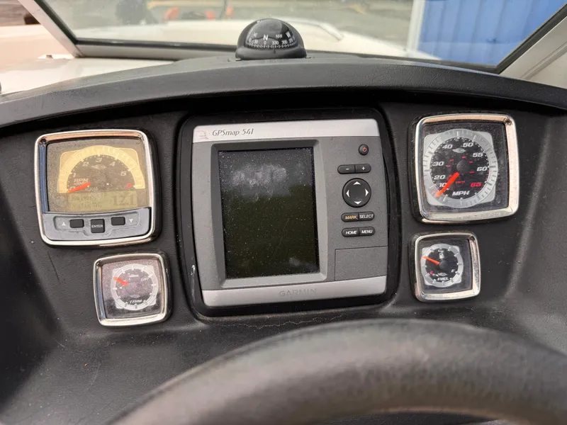 Slide: The Image of Dashboard of 2012 Chaparral 244 Sunesta boat with gauges and GPS display. - 16