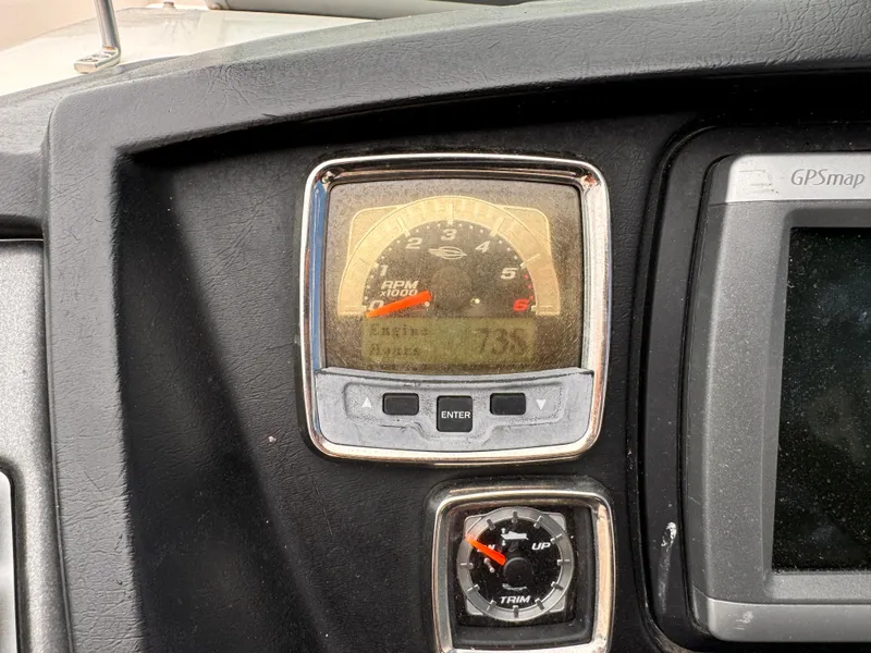 Slide: The Image of Dashboard of 2012 Chaparral 244 Sunesta showing RPM gauge and GPS display. - 17
