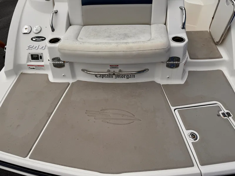 Slide: The Image of Chaparral 244 Sunesta 2012 boat deck with seating and storage compartments. - 19