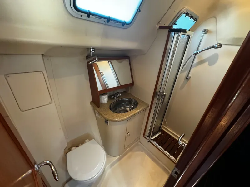 Slide: The Image of 2007 Hunter 41 yacht bathroom with shower, sink, and toilet. - 15