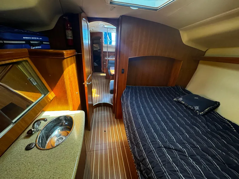 Slide: The Image of Interior cabin of 2007 Hunter 41 sailboat with bed and sink. - 19