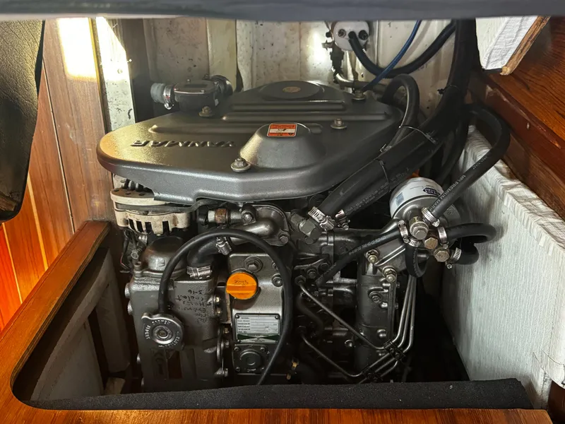 Slide: The Image of Engine compartment of a 2007 Hunter 41 sailboat, featuring a Yanmar diesel engine. - 21