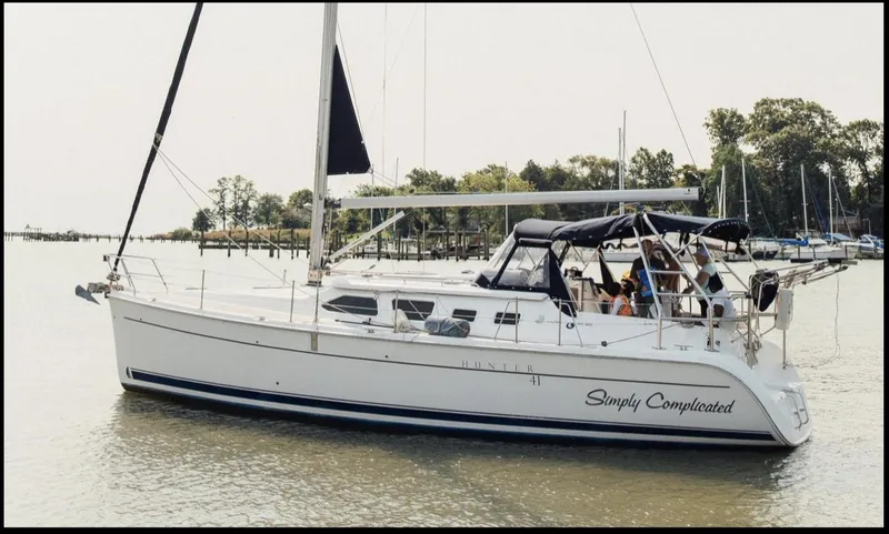 Slide: The Image of 2007 Hunter 41 sailboat named "Simply Complicated" on calm water. - 9