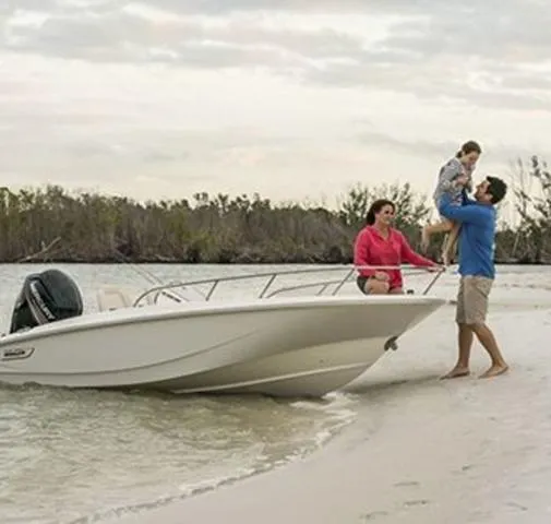 Slide: The Image of Family enjoying a day on a 2024 Boston Whaler 160 Super Sport boat. - 3