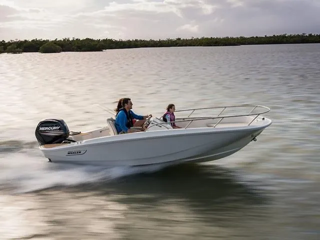 Slide: The Image of 2024 Boston Whaler 160 Super Sport speeding on water with passengers. - 5