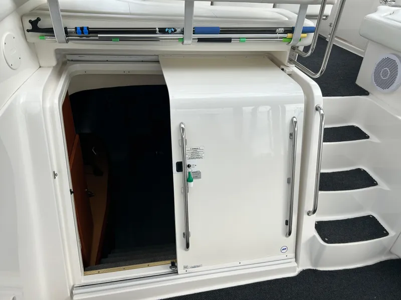 Slide: The Image of 2004 Silverton 39 Motor Yacht entrance with sliding door and stairs. - 11