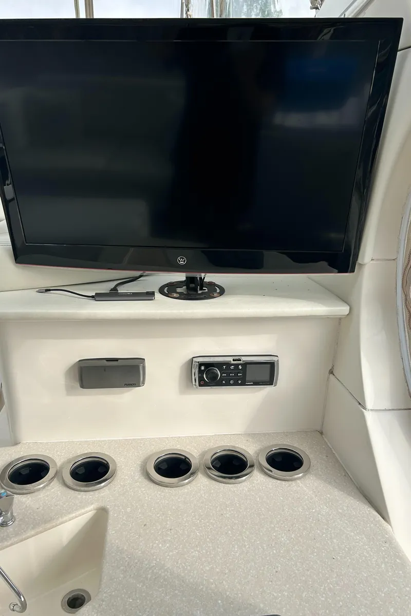 Slide: The Image of 2004 Silverton 39 Motor Yacht interior with TV and control panel. - 13
