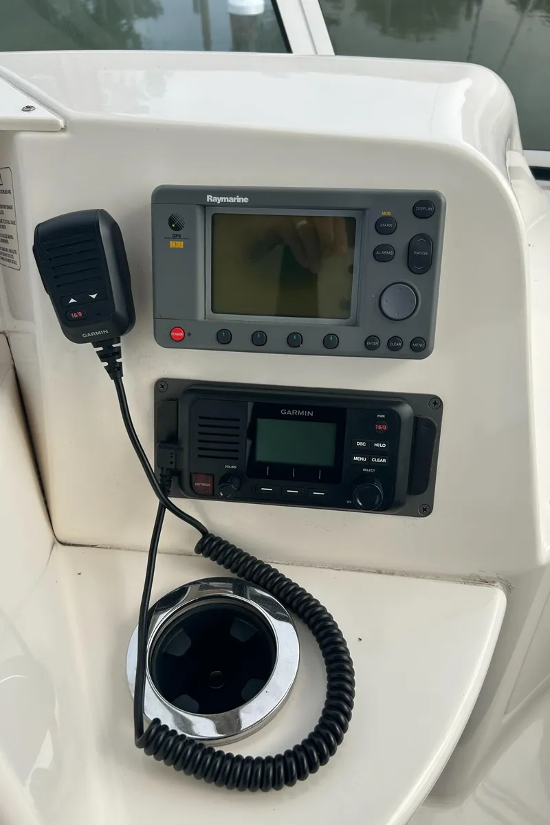 Slide: The Image of 2004 Silverton 39 Motor Yacht dashboard with navigation and communication equipment. - 19