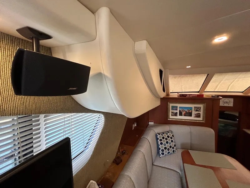 Slide: The Image of Interior of 2004 Silverton 39 Motor Yacht with cozy seating and modern decor. - 25