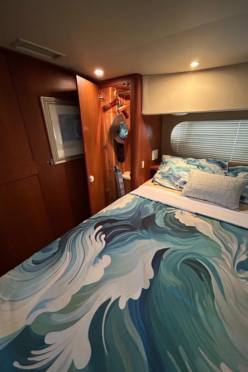 Slide: The Image of Cozy bedroom in 2004 Silverton 39 Motor Yacht with ocean-themed bedding. - 37