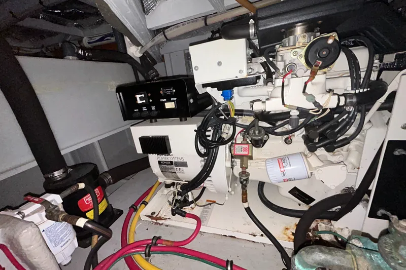 Slide: The Image of Engine room of 2004 Silverton 39 Motor Yacht with visible wiring and components. - 41