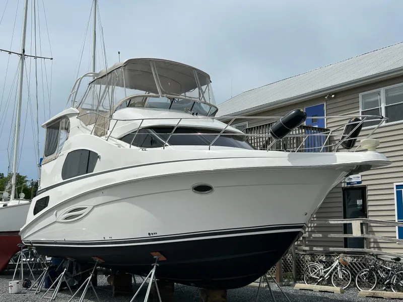 Slide: The Image of 2004 Silverton 39 Motor Yacht on display at a marina. - 45