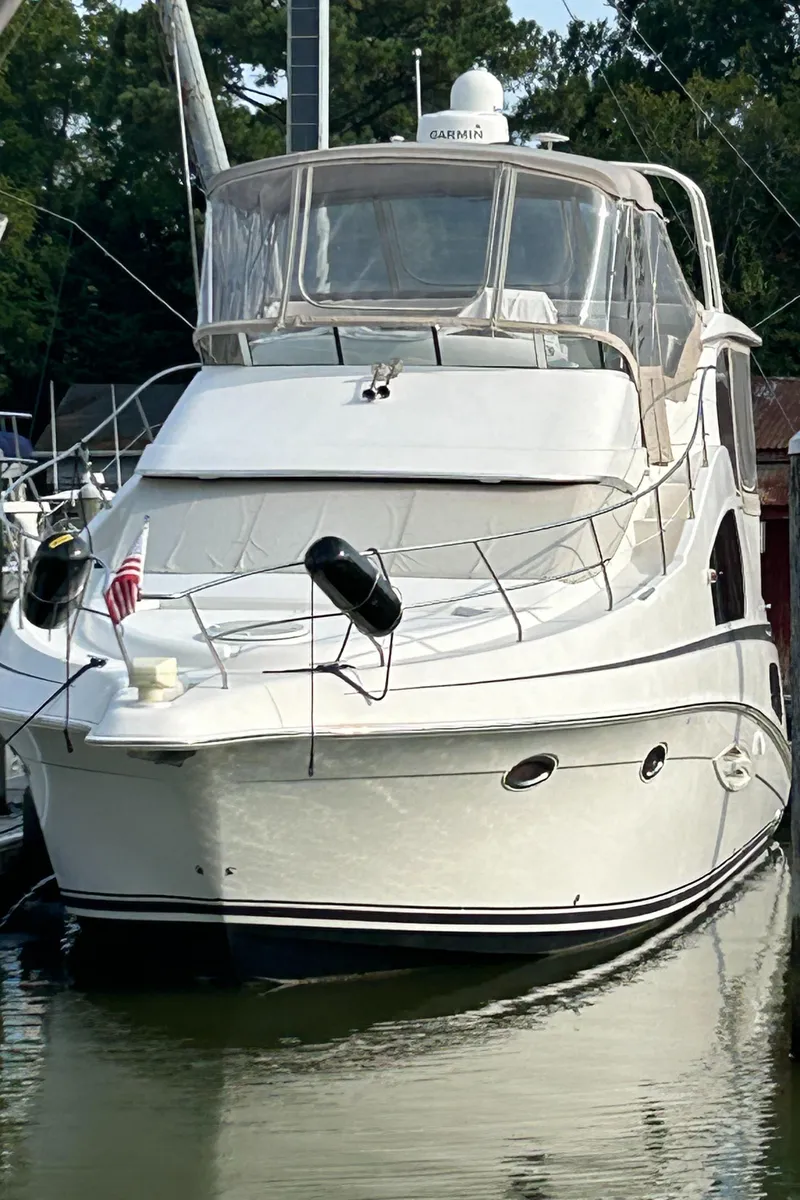 Slide: The Image of 2004 Silverton 39 Motor Yacht docked in a marina. - 7