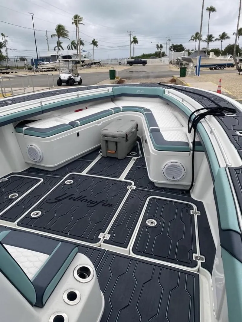 Slide: The Image of 2016 Yellowfin 39 boat deck with seating, storage, and ocean view. - 6