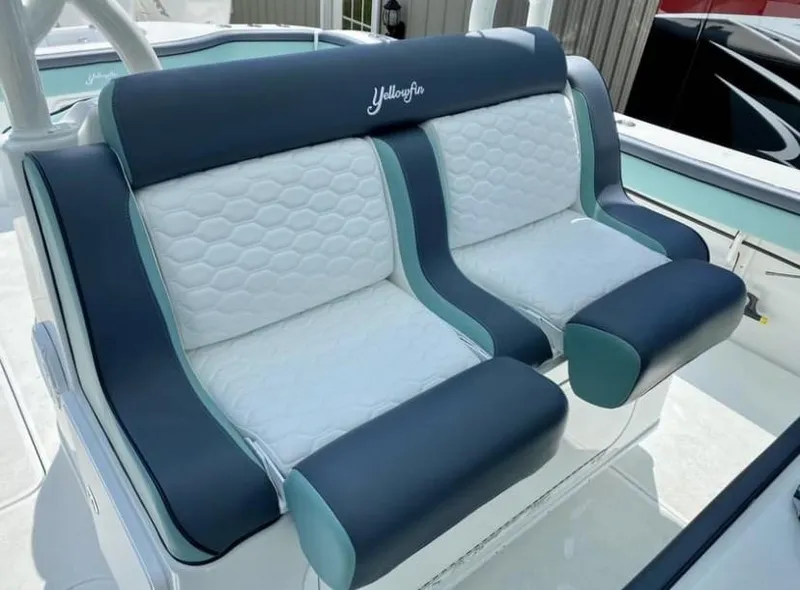 Slide: The Image of 2016 Yellowfin 39 boat seats with blue and white upholstery. - 7