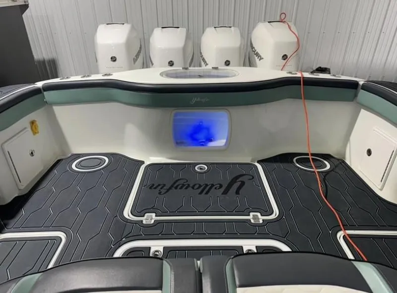 Slide: The Image of 2016 Yellowfin 39 boat interior with four engines, illuminated livewell, and custom flooring. - 9