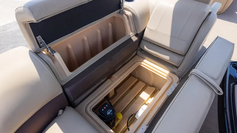 Slide: The Image of Open storage compartment in 2019 Sun Tracker 24 DLX Party Barge boat seat. - 19