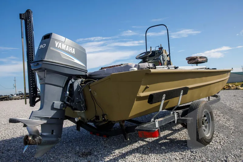 Slide: The Image of 2003 Polar Kraft Sportsman MV1885CC boat with Yamaha motor on trailer. - 11