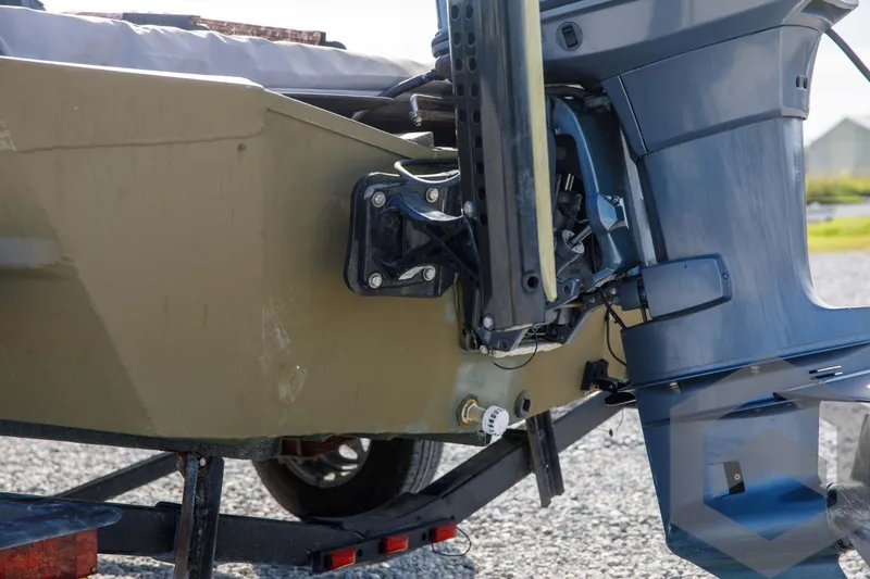 Slide: The Image of 2003 Polar Kraft Sportsman MV1885CC boat with outboard motor on trailer. - 16