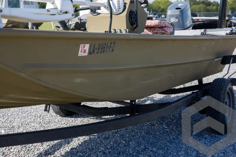 Slide: The Image of 2003 Polar Kraft Sportsman MV1885CC boat on trailer, parked on gravel. - 19