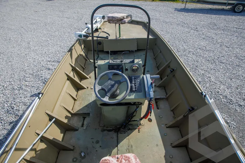 Slide: The Image of 2003 Polar Kraft Sportsman MV1885CC boat interior with steering console and controls. - 20